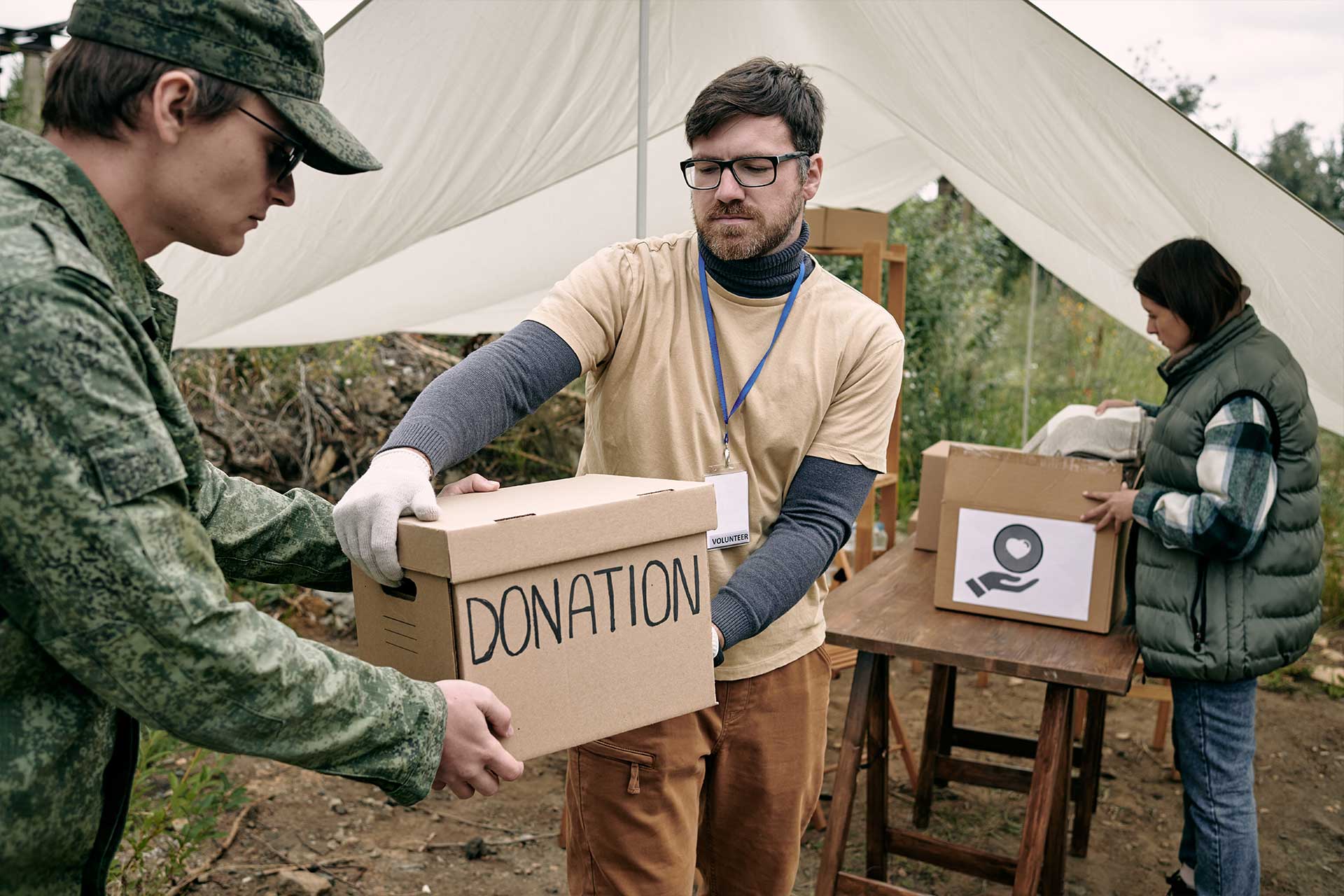 Passing Donation Box to Soldier