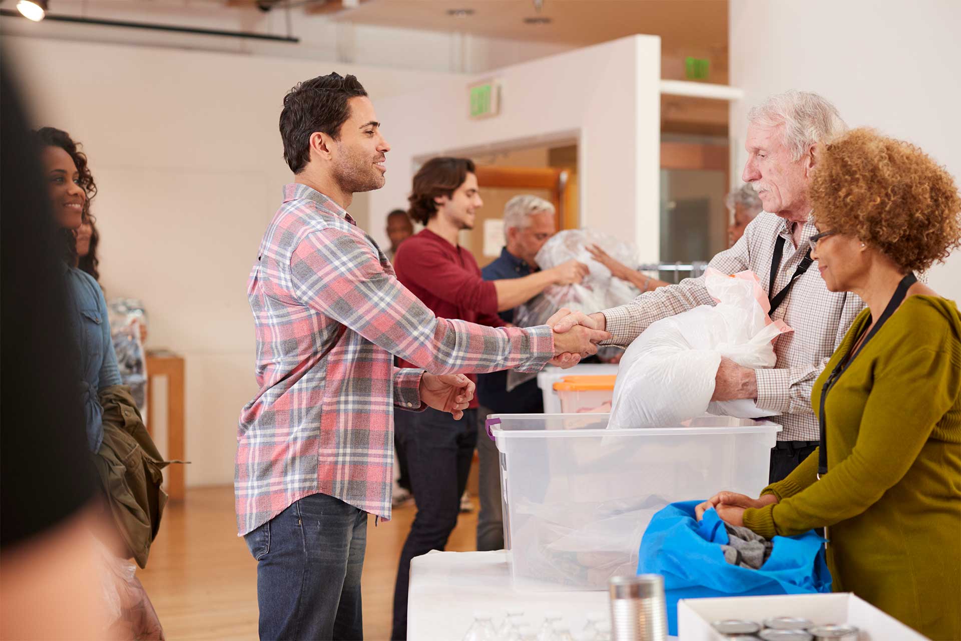 People Donating Clothes to Charity