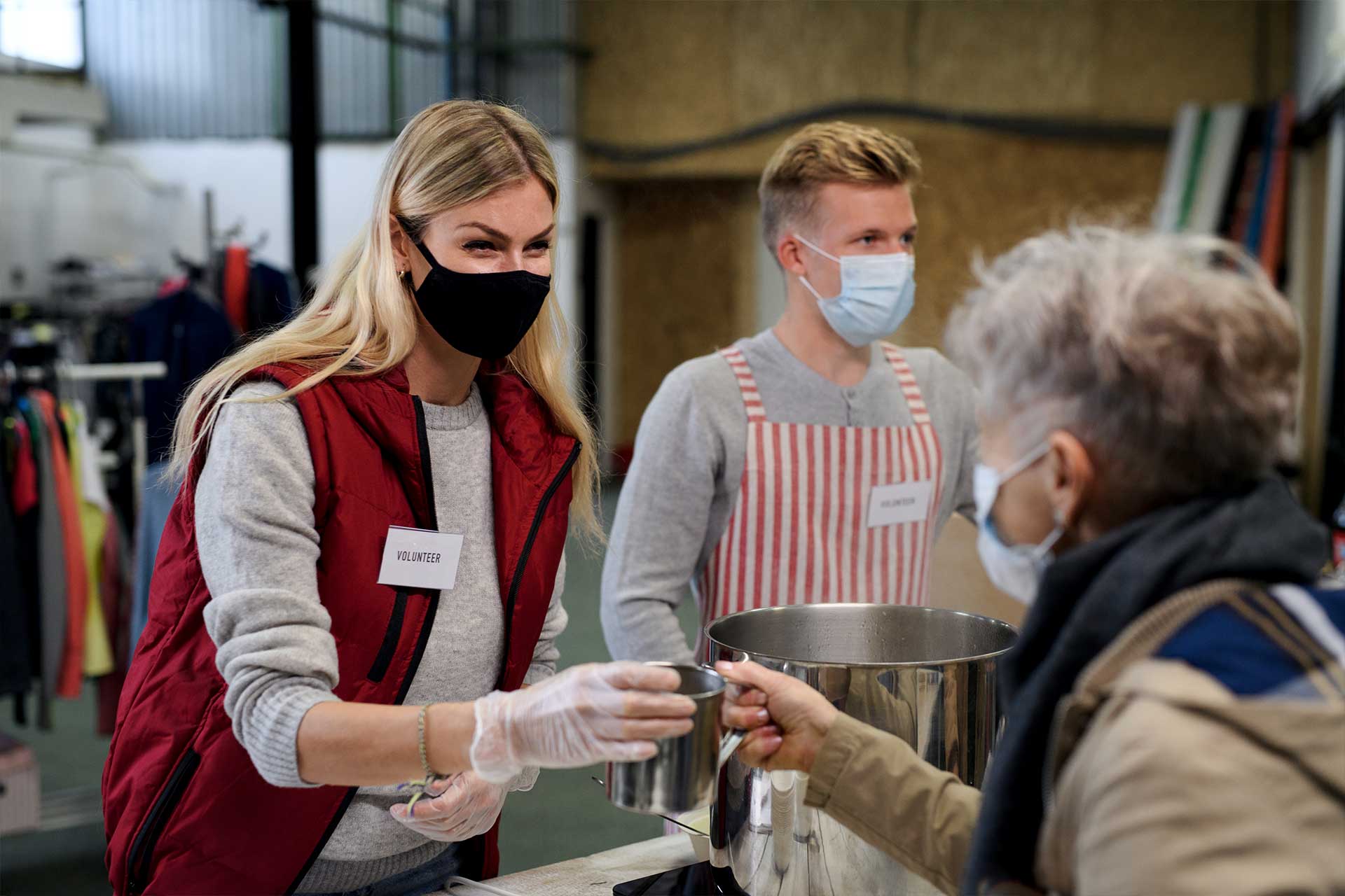 Volunteers Serving Hot Soup for Homeless